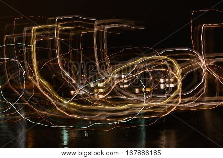Lightpainting light trails and reflections at night - long exposure