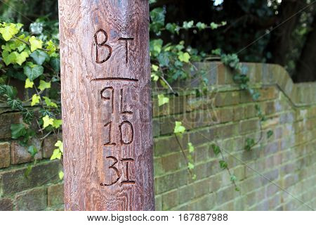 Alresford, Uk - Jan 28 2017: British Telecom Reference Number Carved Into A Traditional Wooden Teleg