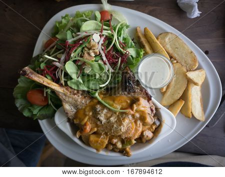 Rack of lamb fried rare isolated in a white dish