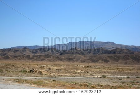 Kopetdag Mountain Range and desert Karakum near Ashgabat - capital of Turkmenistan. Nature of Central Asia.