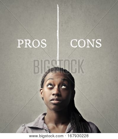 Black woman setting up a table with pros and cons 