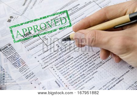 Tax forms 1065 and w4 close up