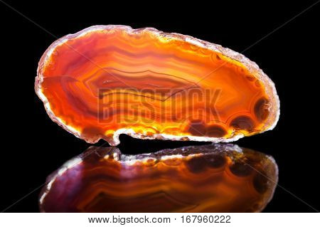 Orange Agate Slice, Black Background, Healing Stone And Mineral