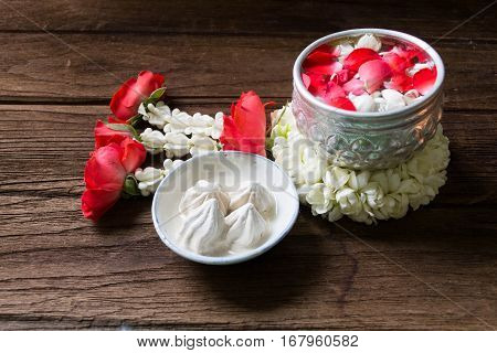 Water in bowl mixed with perfume and flowers corolla for Songkran festival in Thailand.