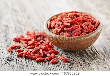 Goji berries on a wooden board