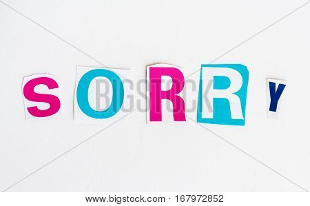 Sorry cut from newspaper letters isolated on white background