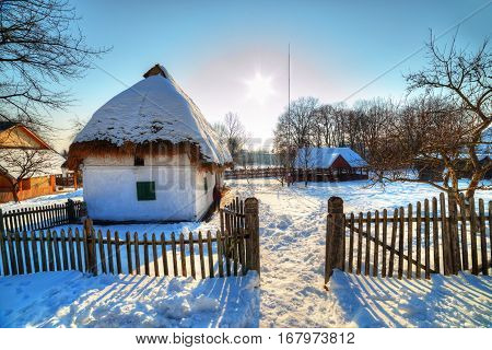 Beautiful outdoor scene from village museum of Baia Mare, with an old cottage in a garden at sunset. Visit Transylvania - Romania