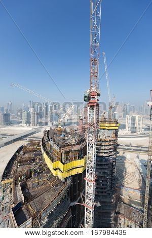 United Arab Emirates, Dubai, 05/21/2015, Damac Towers Dubai by Paramount, construction and building ariel views with cityscape background