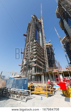United Arab Emirates, Dubai, 05/21/2015, Damac Towers Dubai by Paramount, construction and building ariel views with cityscape background