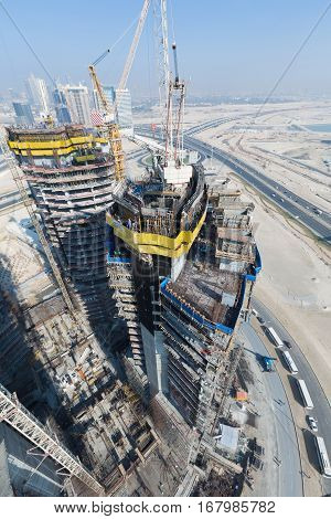 United Arab Emirates, Dubai, 05/21/2015, Damac Towers Dubai by Paramount, construction and building ariel views with cityscape background