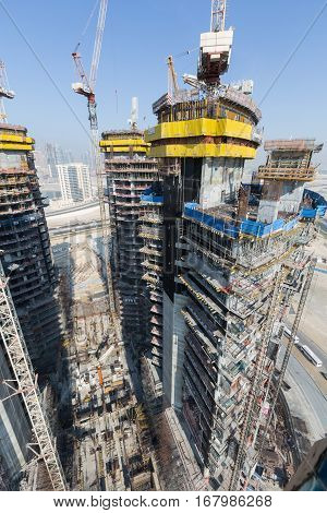 United Arab Emirates, Dubai, 05/21/2015, Damac Towers Dubai by Paramount, construction and building ariel views with cityscape background