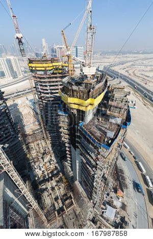United Arab Emirates, Dubai, 05/21/2015, Damac Towers Dubai by Paramount, construction and building ariel views with cityscape background