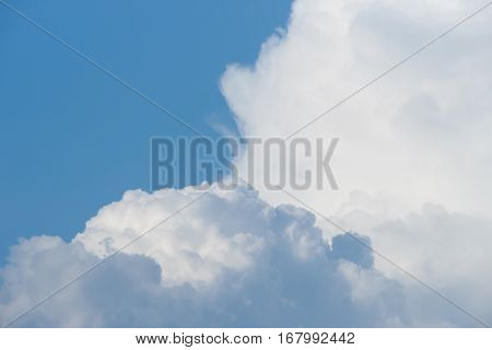White light clouds in the clear blue sky