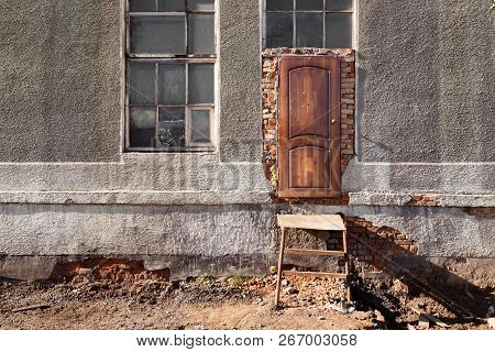 Entrance To Destroyed Building, Wooden Door, Metal Staircase, Window With Old Wooden Frames, Red Bri
