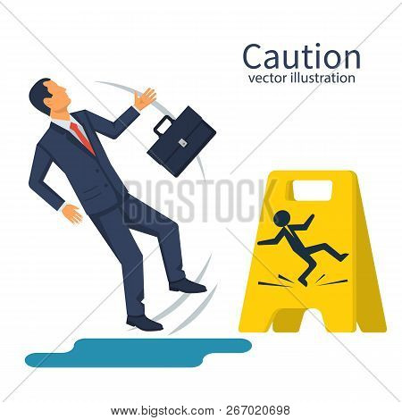 Businessman With A Briefcase Fell On A Wet Floor. Floor Sign Of Danger. Cleaning In Progress. Wet Fl