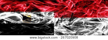 Egypt, Egyptian Vs Monaco, Monacan Smoke Flags Placed Side By Side. Thick Abstract Colored Silky Smo