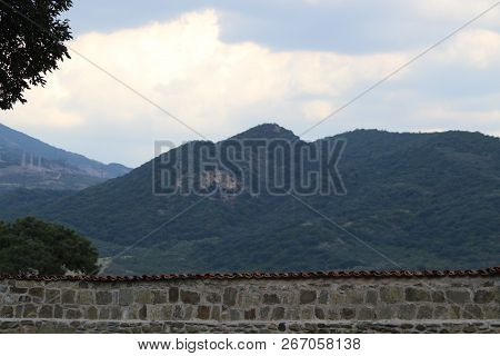 Stone Wall And Mountains Outside In Mtskheta Town In Georgia