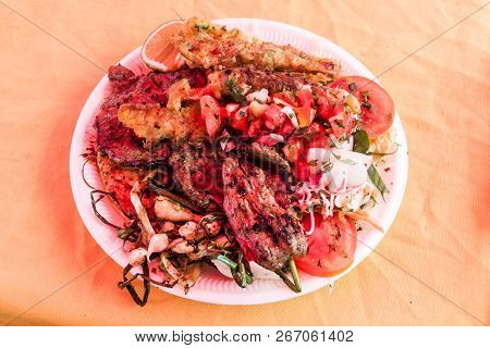 Meat With Vegetable At The Weekend Food Court On The Main Square Of Juayua Village, El Salvador