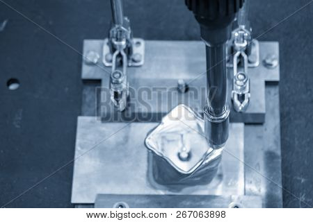 The Welding Robot Machine For Welding Automotive Part In The Light Blue Scene.industrial 4.0 Concept
