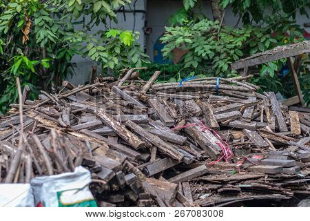 Pile Of Sliver, Lumber, Scantling Near The House