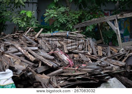 Pile Of Sliver, Lumber, Scantling Near The House