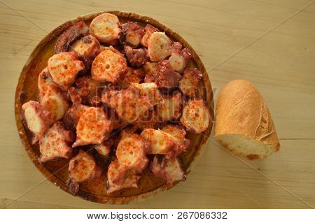 Ration From Octopus To Feira With Spicy Paprika With A Piece Of Bread To The Side At The Becerrea Oc