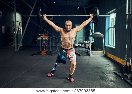 Sportsman With Prosthesis Working Out In Gym