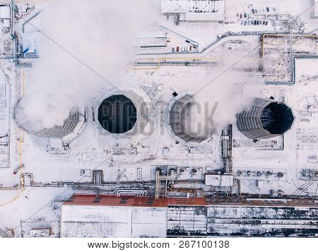 Aerial Top View Clouds Of Smoke And Steam Cooling Tower Industrial Heat Electro Central Coal. Enviro