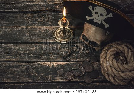 Pirate Captain Table With Pirate Hat, Human Skull, Treasure Coins, Mooring Rope, Burning Candle And 