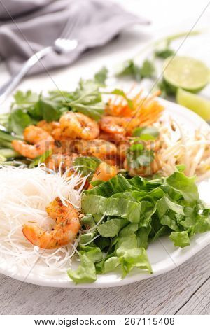 asian meal with shrimp, noddles and vegetables