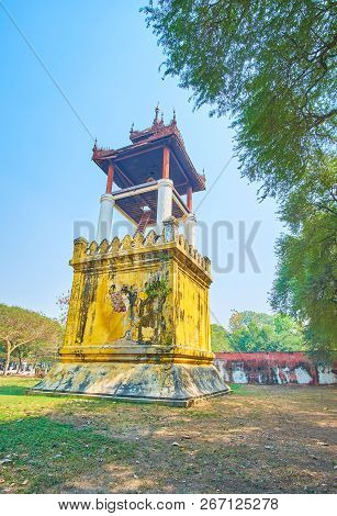 The High Clock Tower In Burmese Style With Huge Bell Under The Pyatthat Roof, Mandalay Palace, Myanm