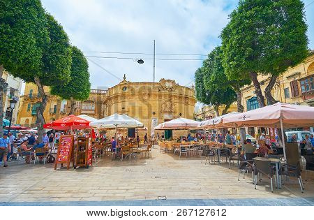 Victoria, Malta - June 15, 2018: Independence Square Is The Nice Place To Relax In Outdoor Restauran