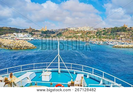 The Ro-ro Ferry Arrives To The Mgarr Harbour Of Ghajnsielem Town On Gozo Island, Malta.