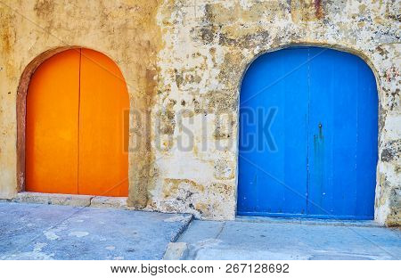 The Colorful Wooden Doors Of Boat Houses In San Lawrenz Fishing Village, Gozo Island, Malta.