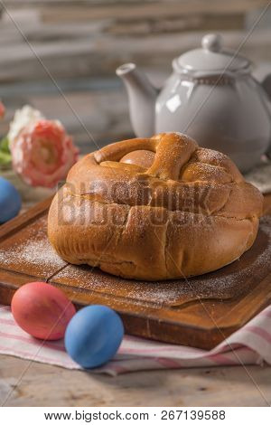 Portuguese Traditional Easter Cake. Folar With Eggs On Wooden Table