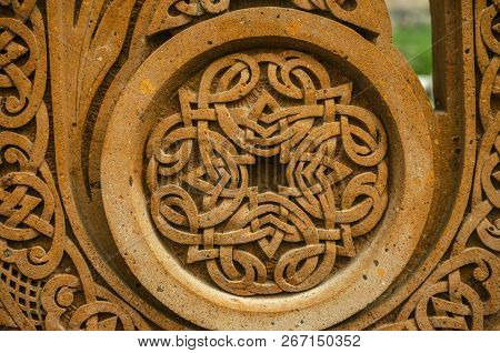Oshakan,armenia,19 Februar,2018:round Carved Frame On A Red Stone With An Ornament Of Intertwining S