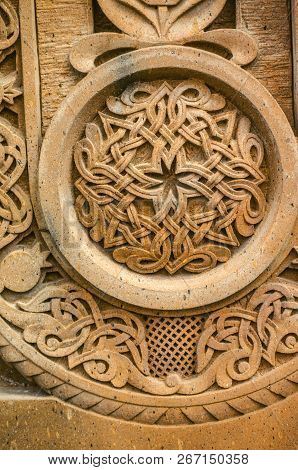 Oshakan,armenia,19 Februar,2018:carved Round Ornament With Intertwining Strips Forming A Pattern Pla