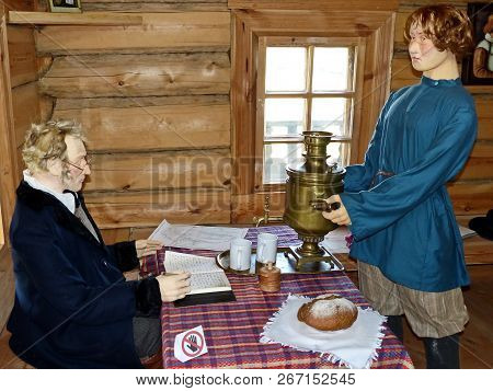 Nizhnyaya Sinyachikha,russia-aug 05, 2018:the Eldest Son Of The Owner Brings Guests Samovar.the Scie