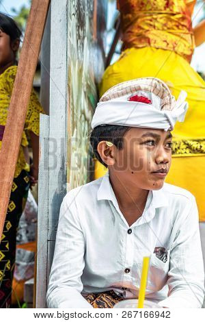 Bali, Indonesia - October 9, 2018: Balinese Boy In Traditional Clothes On Culture Ceremony, Ubud, Gi