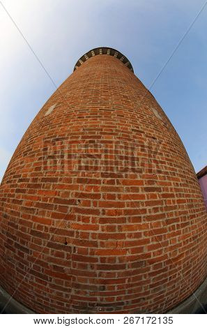 High Tower Of The Old Aqueduct Made With Red Bricks Photographed With Fish Eye Lens In Italy