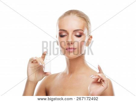 Young Girl Using Nosal Spray Aerosol And Drops Isolated On White. Runny Nose, Allergy, Cold And Flu 