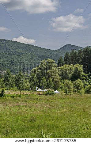 Summer Public Bivouac  With Tent, Table, Chair, Banner And  Place In The Field For Competition, Loze