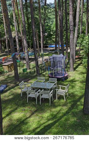 Lozen Mountain, Bulgaria - June 11, 2018: Summer Child Public Bivouac  With Table, Chair, House And 