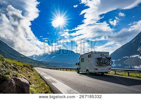 Family vacation travel RV, holiday trip in motorhome, Caravan car Vacation. Beautiful Nature Norway natural landscape.