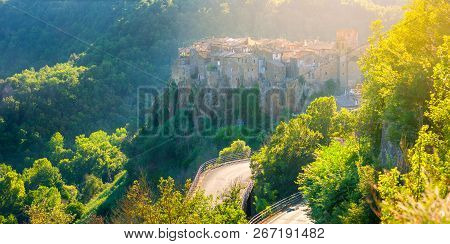 Street Of The Old City Of Siena Overlooking The Tower Of Torre Del Manja, Sienna. Italy