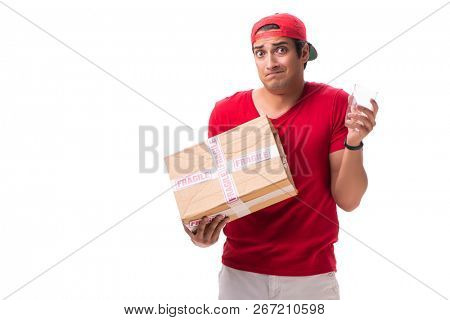 Handsome contractor holding fragile box isolated on white 