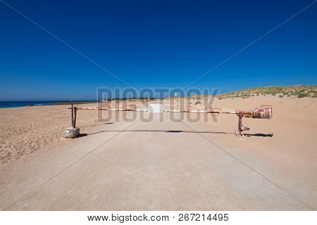White And Red Old Metal Barrier Closed On Road To Trafalgar Cape, In Canos Meca Village (barbarte, C