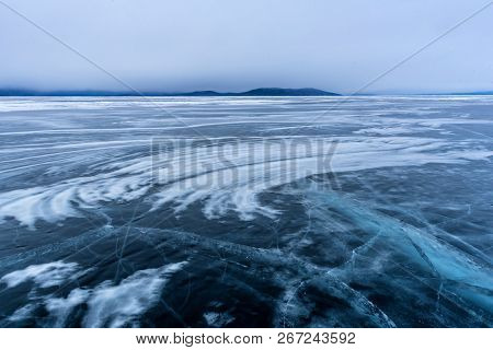 Lake Khubsugul Is Covered With Ice And Snow, Strong Cold, Thick Clear Blue Ice. Lake Khubsugul Is A 