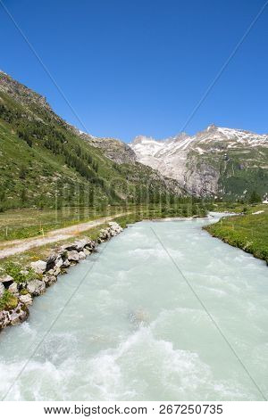 Rhone glacier, source of Rhone river, melting and retreating due to global warming. Rhone glacier is loosing up to 2 meters in length every year.