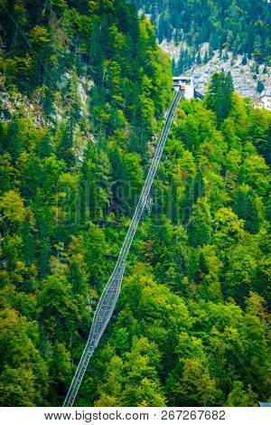 funicular railway over the green mountanious forest
